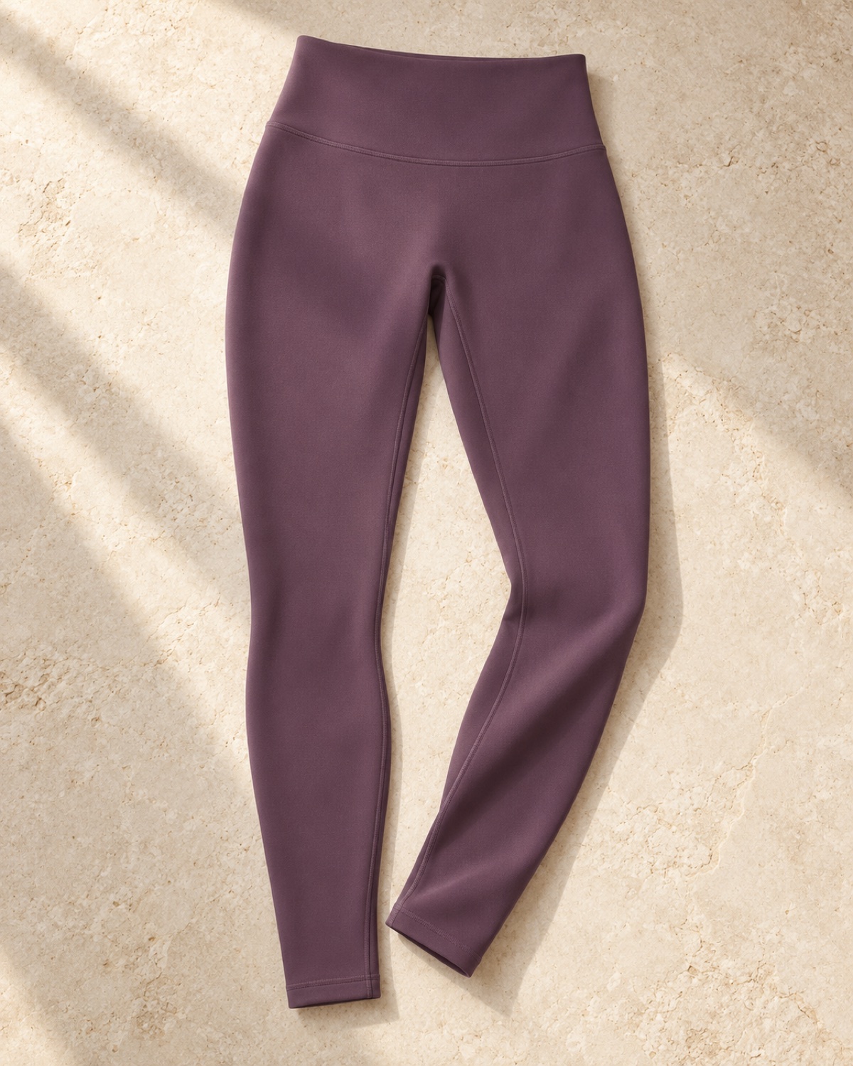 Model-free editorial reconstruction of the plum Formwynn Flow Core Legging with its high waistband